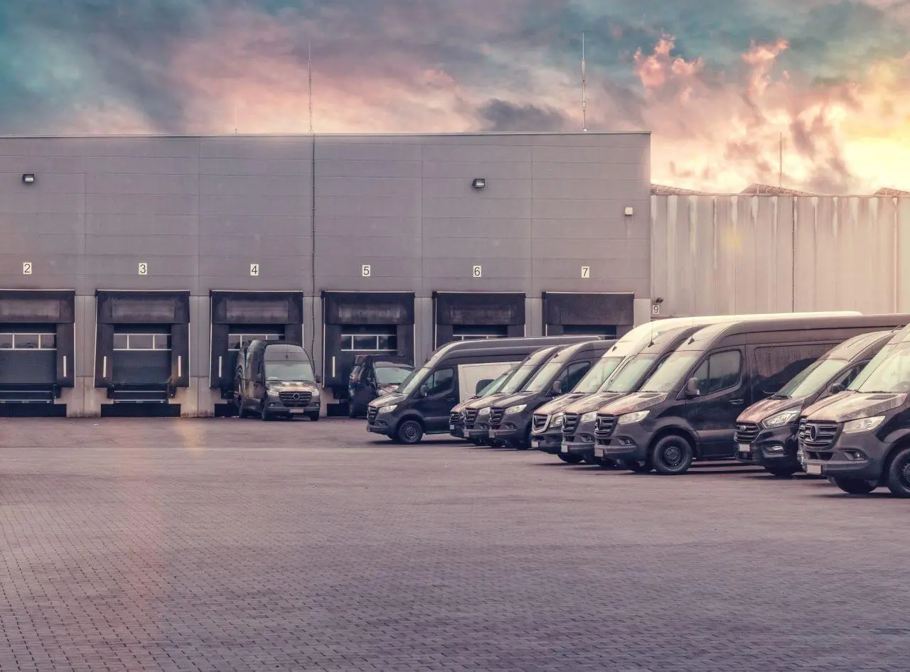 Fleet vans parked in a parking lot