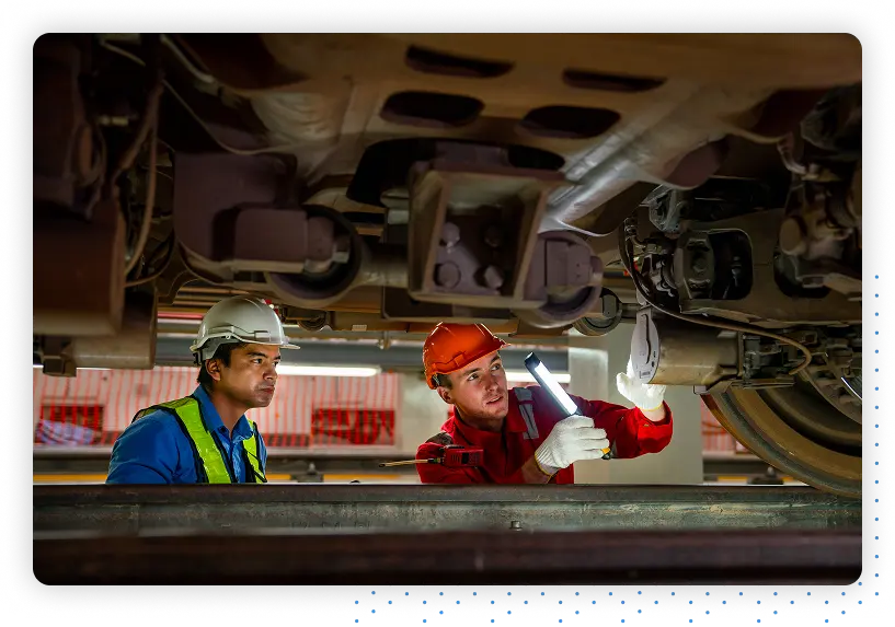 Mechanics working under a car