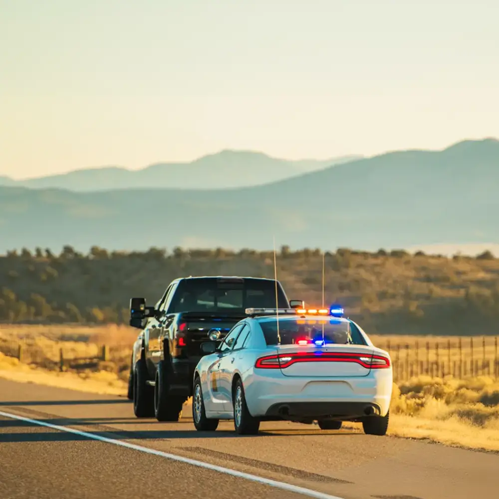 Police car stopping a vehicle on a highway